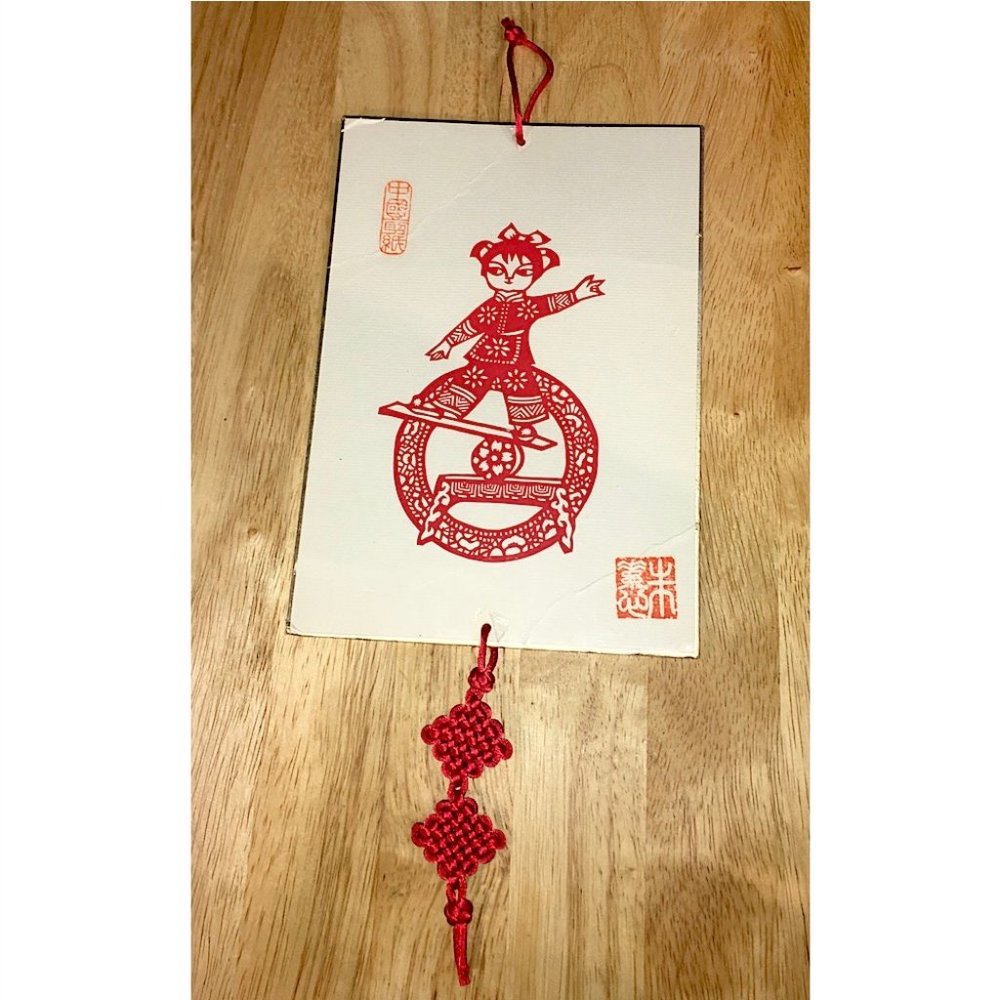 Traditional Chinese Paper Cut Art Girl Balancing